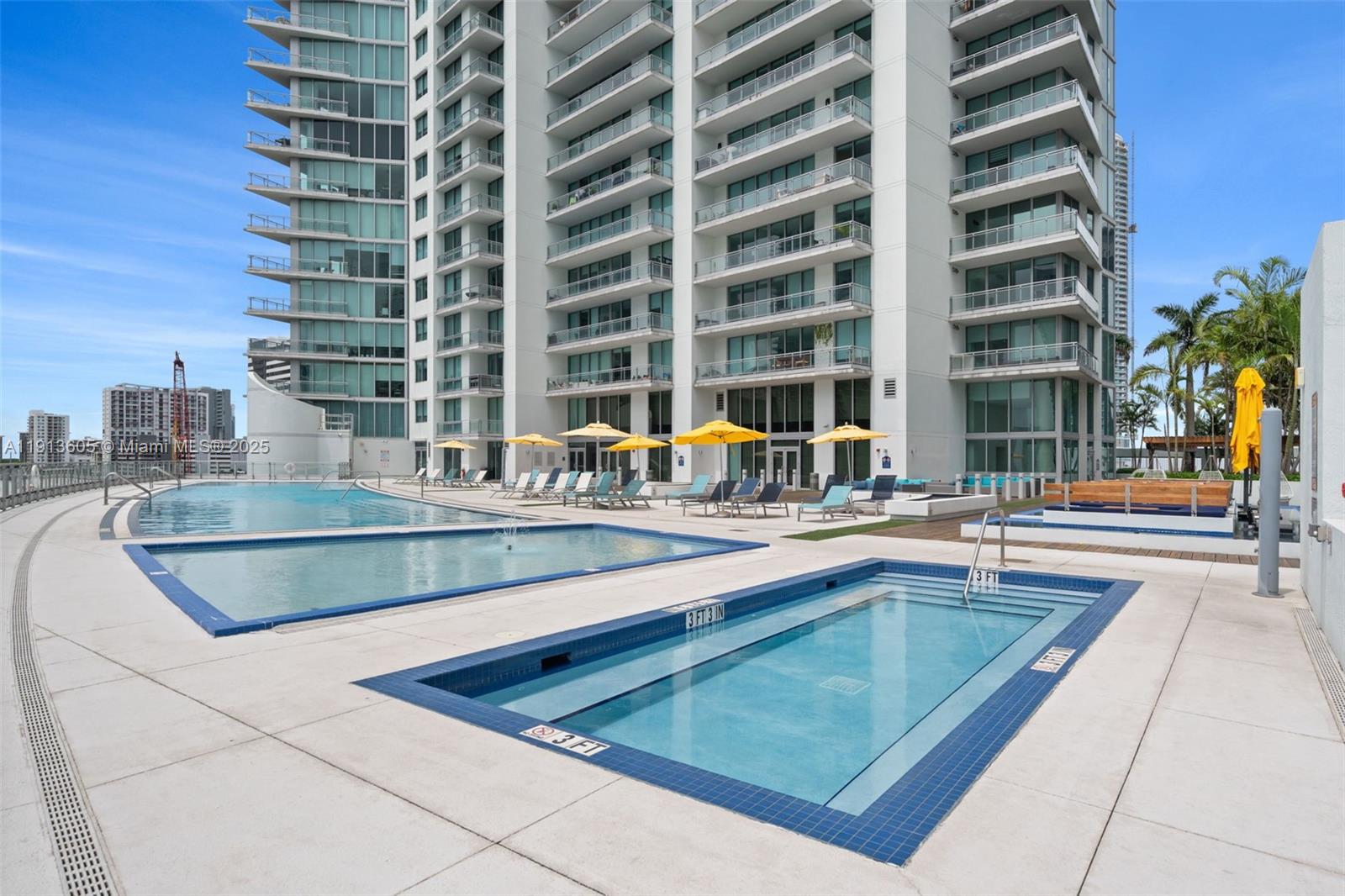 92 Southwest 3rd Street, Unit 4403 Miami, FL 33130 - Photo 24 of 28 a view of swimming pool with outdoor seating and city view