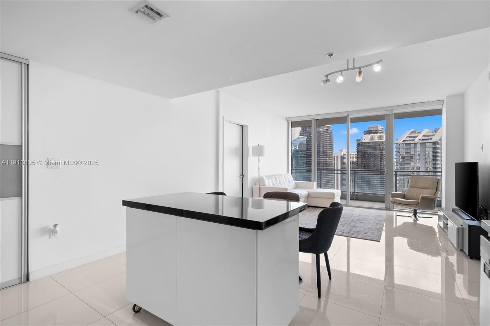 92 Southwest 3rd Street, Unit 4403 Miami, FL 33130 - Photo 6 of 28 a view of a livingroom with furniture and window