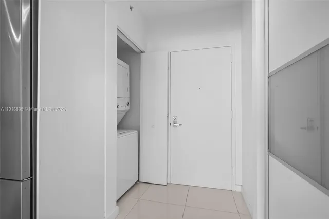 a kitchen with a dining table chairs and white appliances