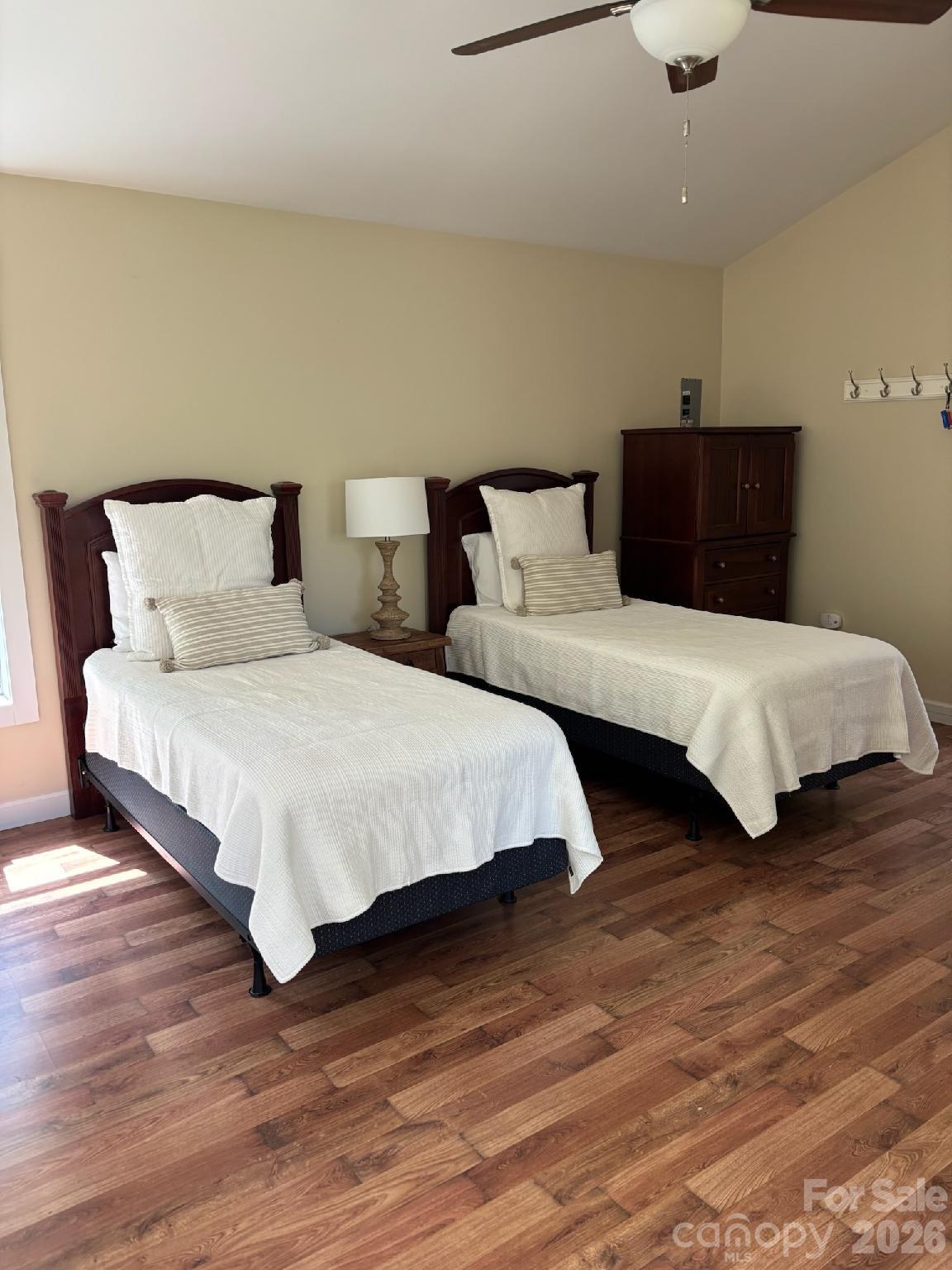 324 Marble Mine Road Bakersville, NC 28705 - Photo 23 of 45 a bedroom with a bed and wooden floor