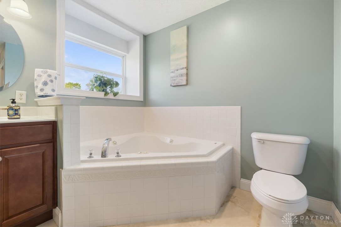 841 Willow Road Springfield, OH 45502 - Photo 21 of 64 This bathroom features a deep soaking tub, perfect for unwinding.