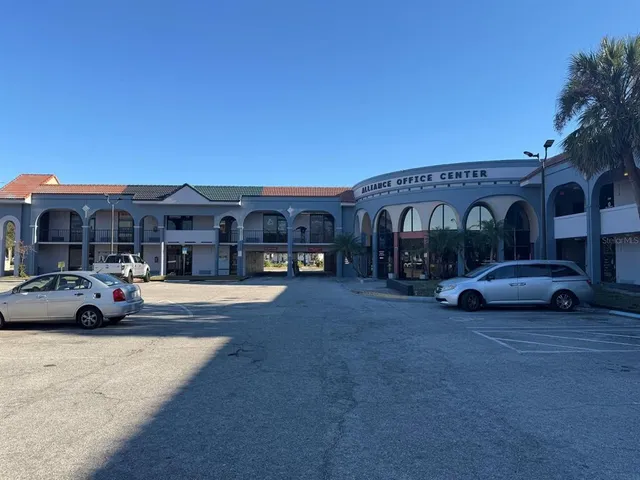 a view of street with parked cars