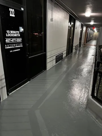 a view of gallery with a large mirror