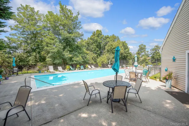 a view of a chairs and table in the patio
