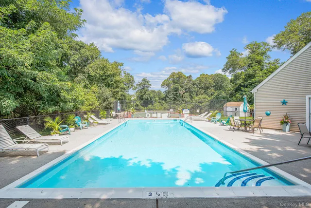a view of a swimming pool with an outdoor space