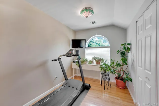 a workspace with furniture window and wooden floor