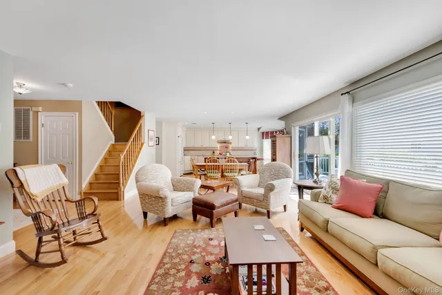 a living room with furniture or couch and a dining table