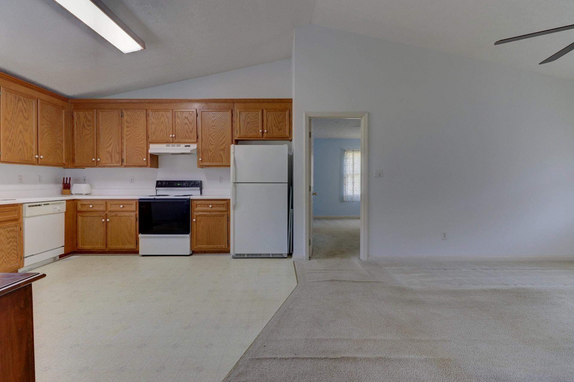 5331 Bethlehem Road Boones Mill, VA 24065 - Photo 6 of 21 a kitchen with stainless steel appliances a refrigerator and a stove top oven