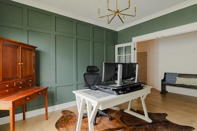 a view of a workspace with furniture