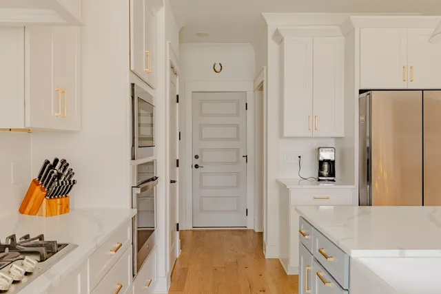 a kitchen with a refrigerator and a sink