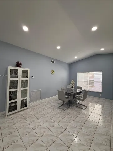 a living room with furniture and window