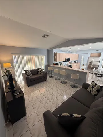 a living room with furniture and a window