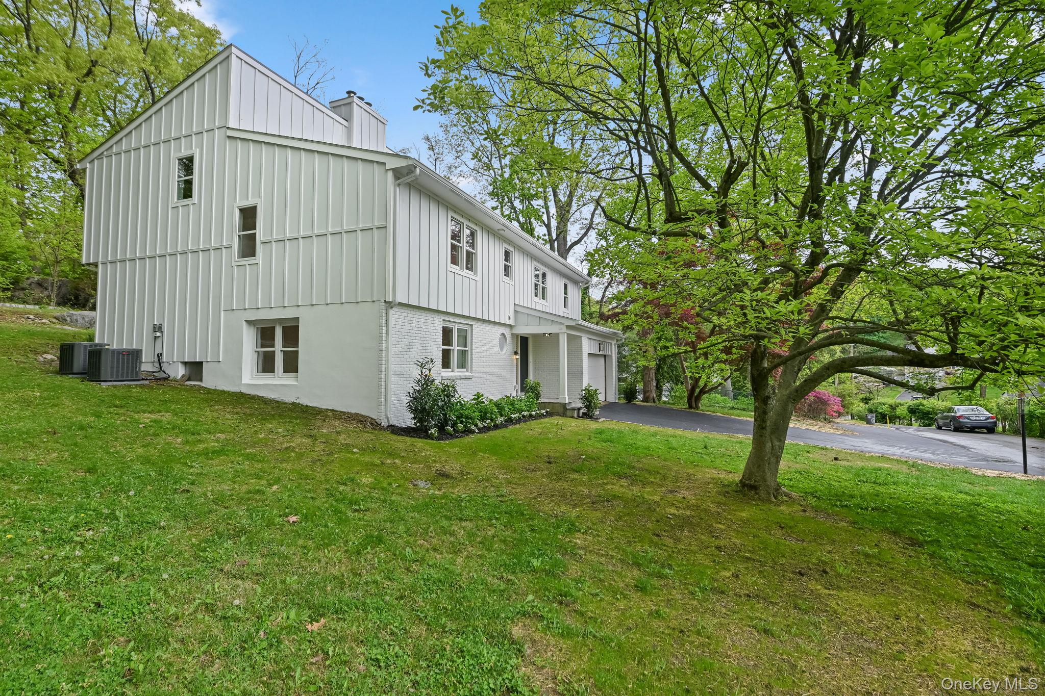 24 Country Road Mamaroneck, NY 10543 - Photo 32 of 37 a view of a back yard of the house
