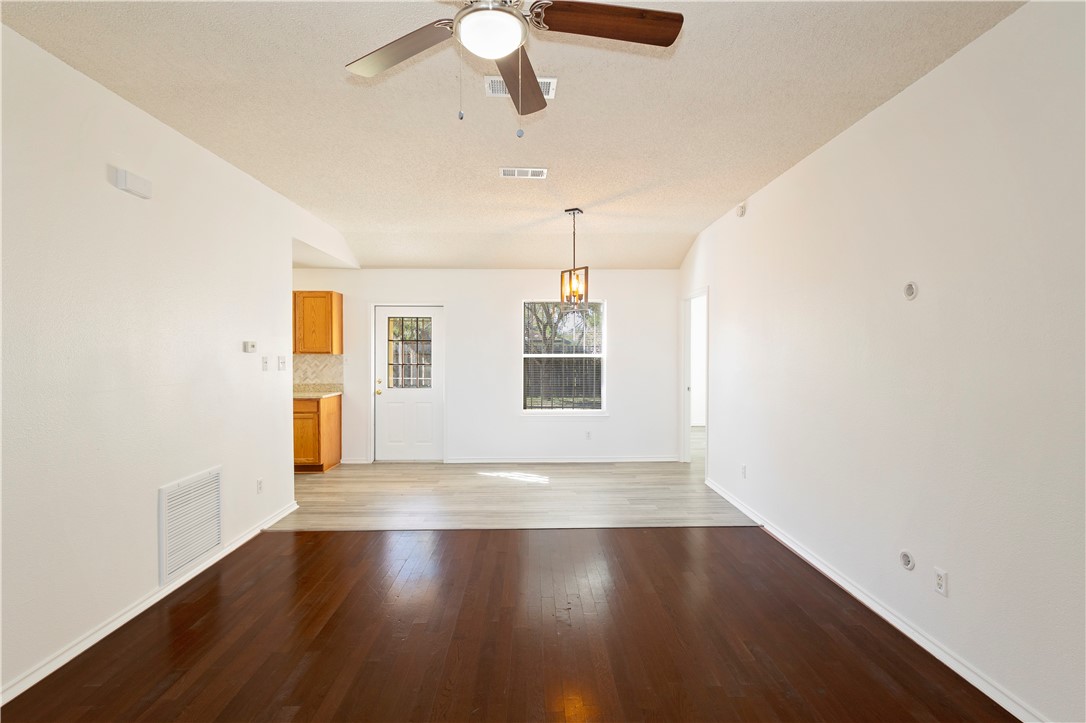 1833 Promise Corpus Christi, TX 78412 - Photo 5 of 19 a view of an empty room with wooden floor and a window