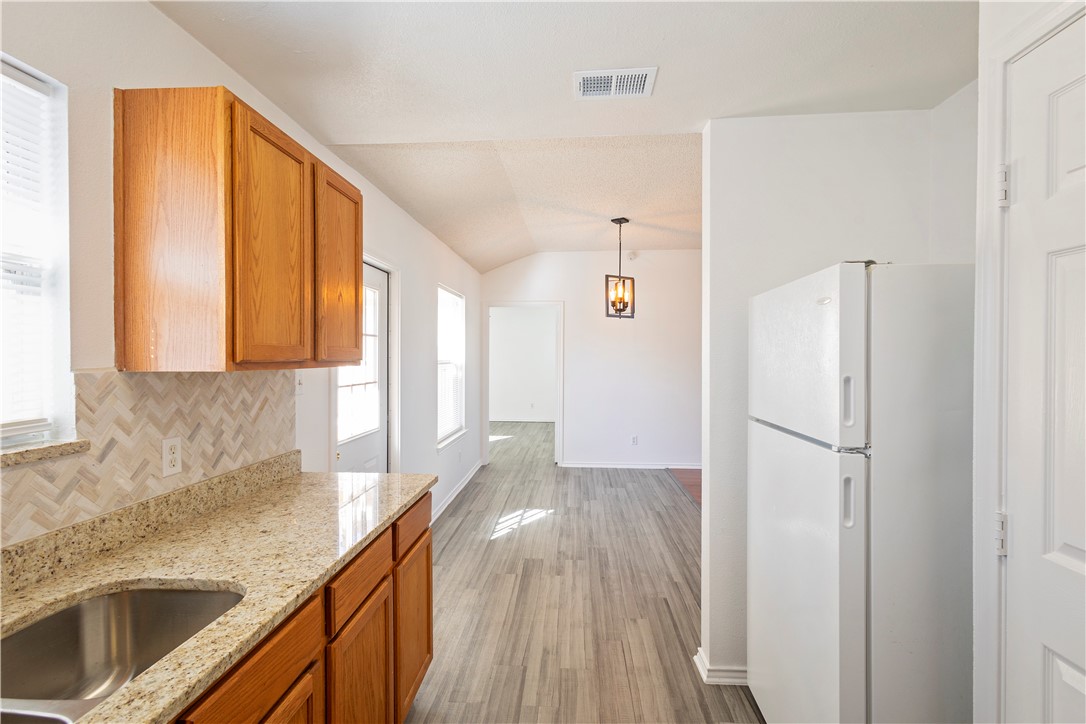 1833 Promise Corpus Christi, TX 78412 - Photo 9 of 19 a kitchen with a refrigerator and a sink