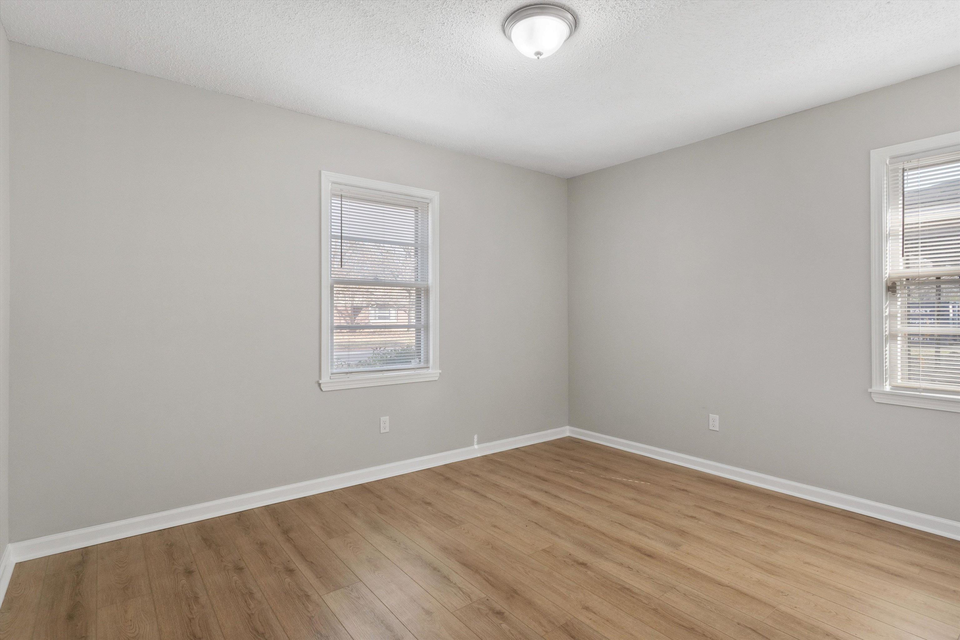 4487 East Dearing Road Memphis, TN 38117 - Photo 14 of 27 Spare room featuring a textured ceiling and light wood finished floors