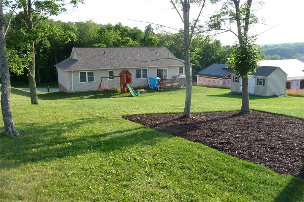 386 Lemmon Road Latrobe, PA 15650 - Photo 23 of 25 Another view of the rear yard. New construction under way next door. Shed conveys with the house!
