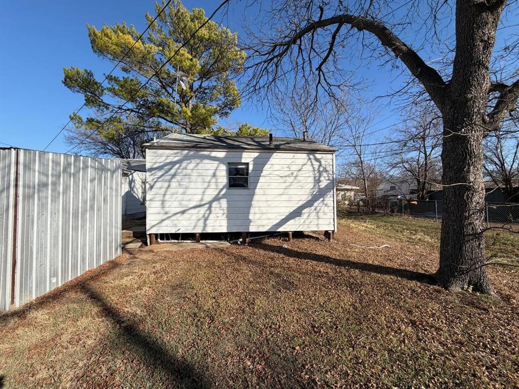 814 Tennessee Street Graham, TX 76450 - Photo 10 of 10 a view of a backyard with wooden fence