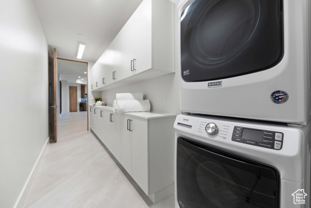 3558 South Cypress Road Hurricane, UT 84737 - Photo 38 of 57 Laundry room with stacked washing maching and dryer and cabinets
