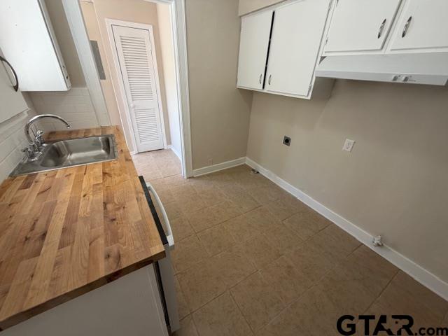 923 North Tyler Avenue Tyler, TX 75702 - Photo 4 of 9 view of a room with rack on the wall