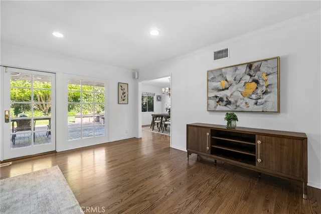 a view of workspace with wooden floor and window