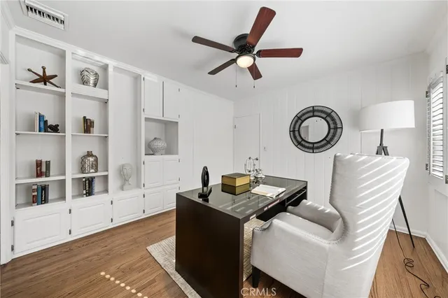 a living room with furniture and a clock