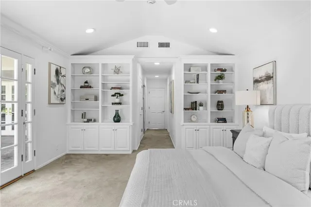 a living room with furniture and white walls