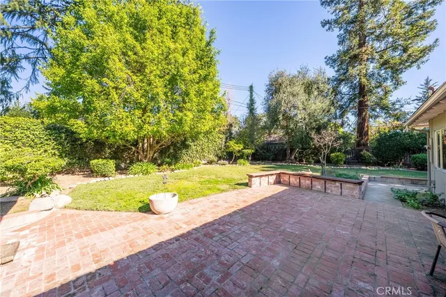 a view of a swimming pool with a yard