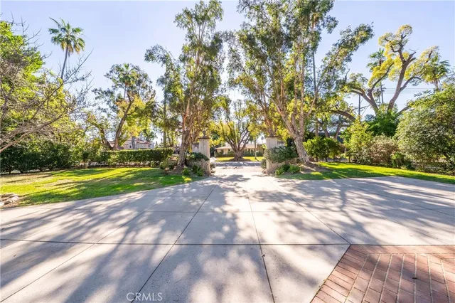 a view of yard with swimming pool and green space