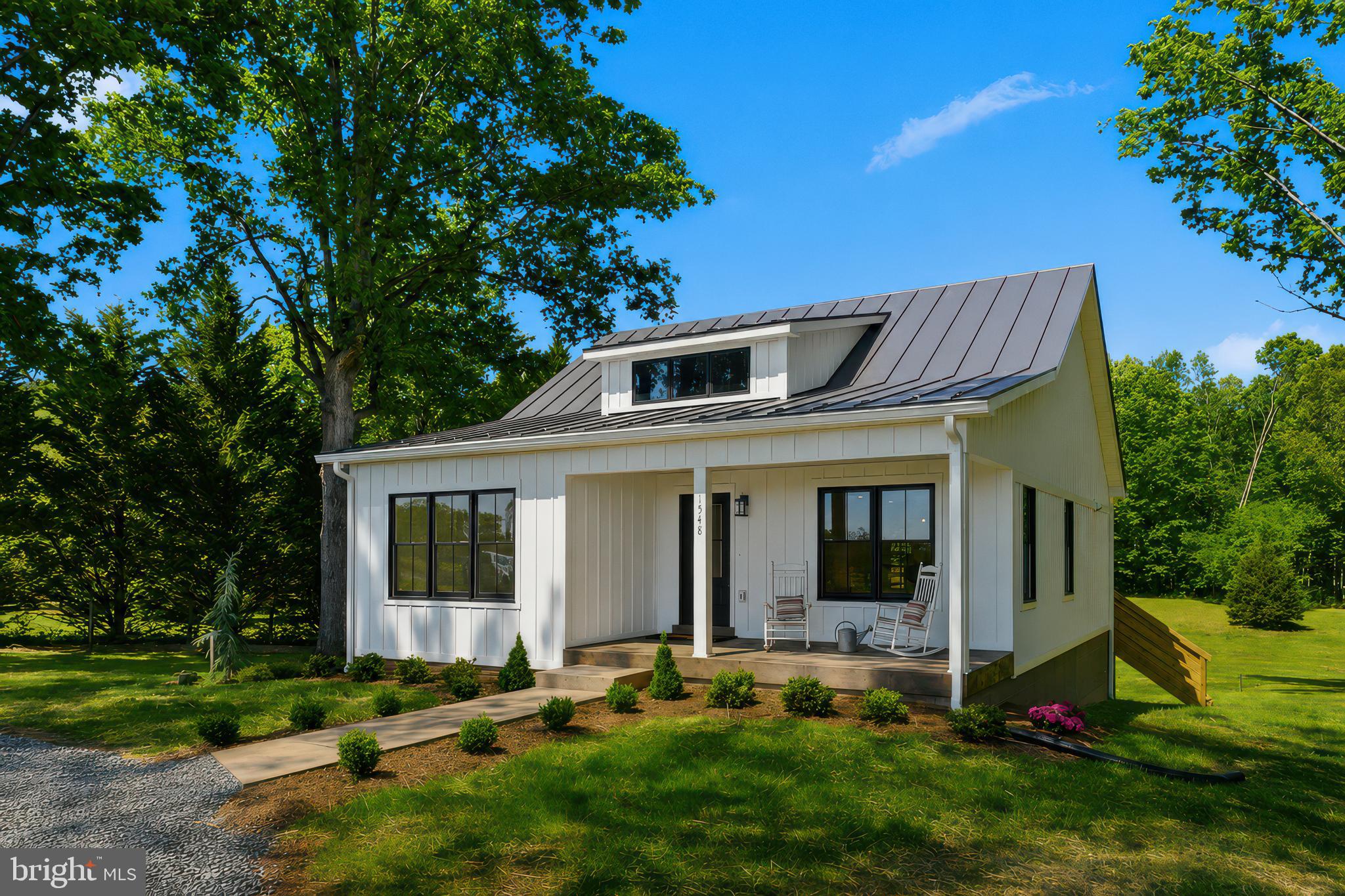 1548 James City Road Reva, VA 22735 - Photo 3 of 48 a front view of house with yard and outdoor seating