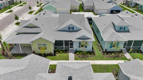 an aerial view of a house with a garden