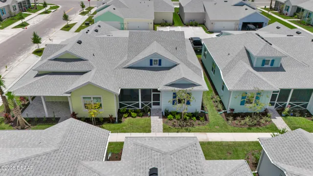 an aerial view of a house with a garden