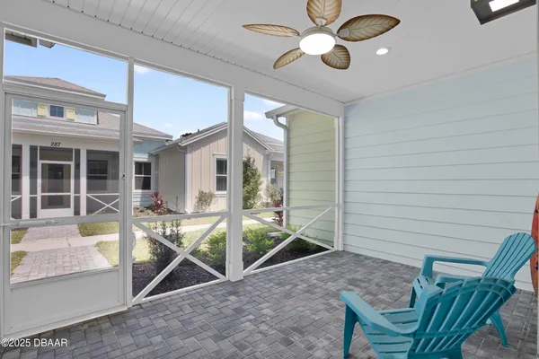 a view of a house with backyard and porch