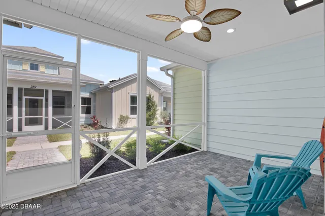 a view of a house with backyard and porch