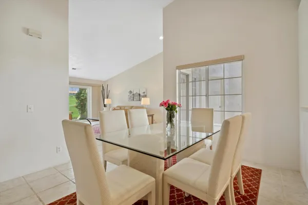 a view of a dining room with furniture and window