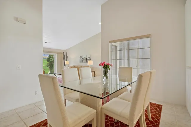 a view of a dining room with furniture and window