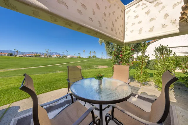 a view of a chairs and table on the terrace
