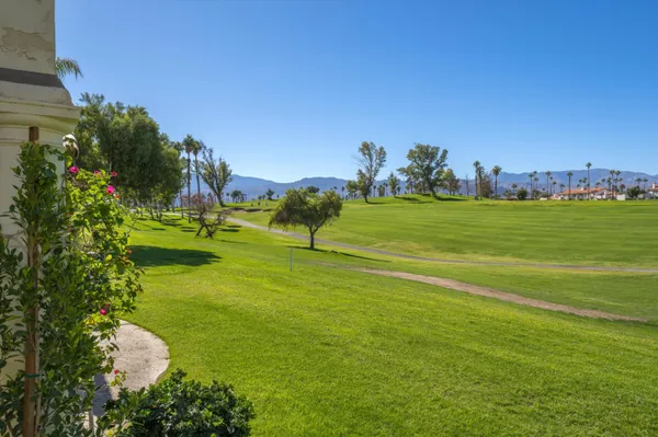 a view of a golf course with a lake
