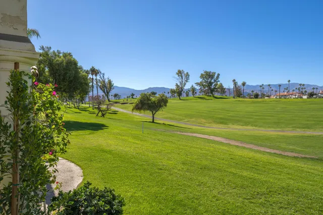 a view of a golf course with a lake