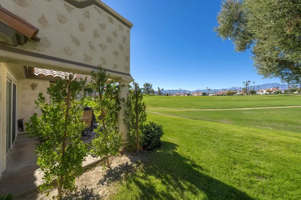 a view of a big yard with an outdoor space