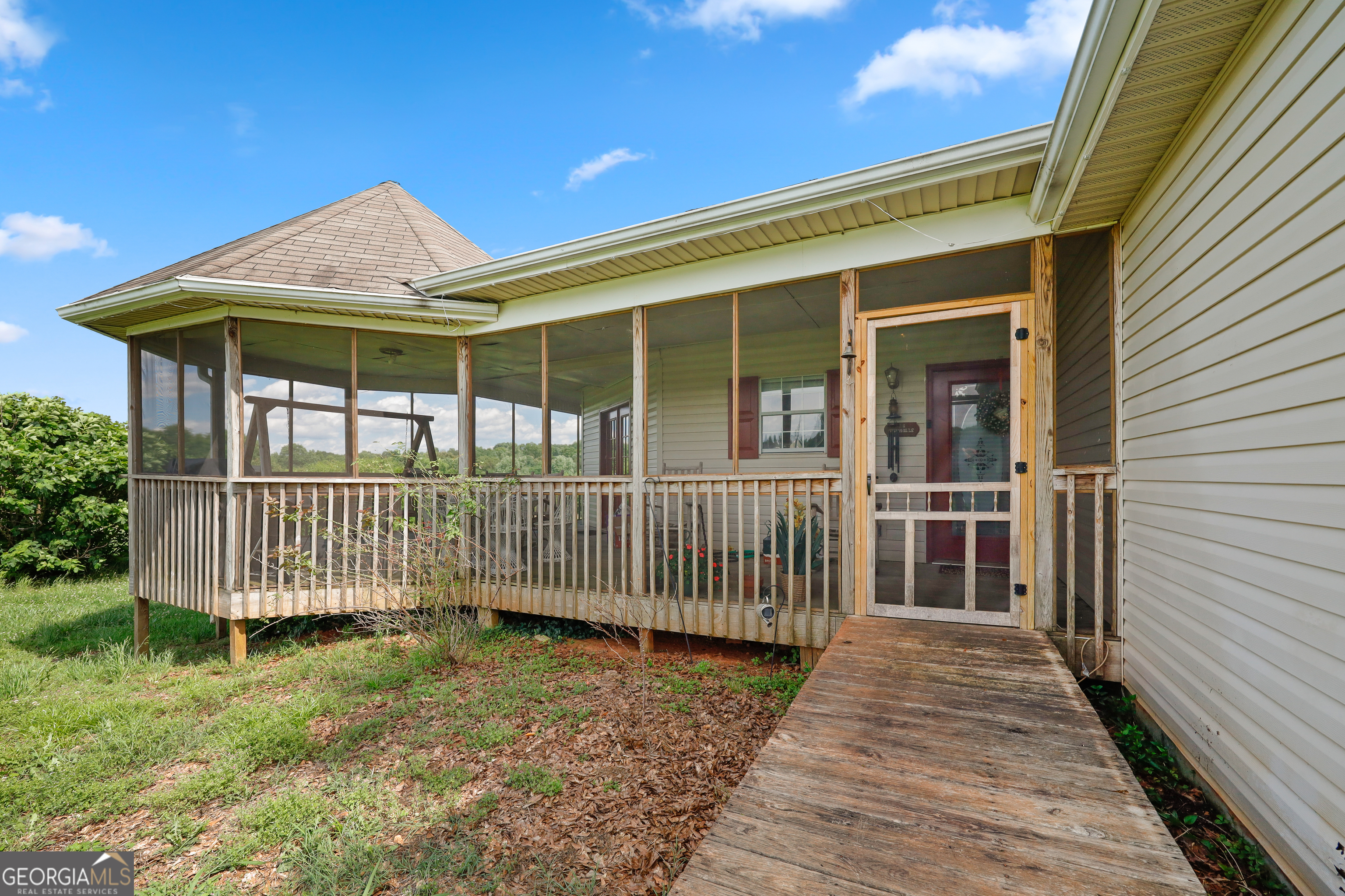 2433 Bear Creek Road Statham, GA 30666 - Photo 52 of 58 a porch with seating space