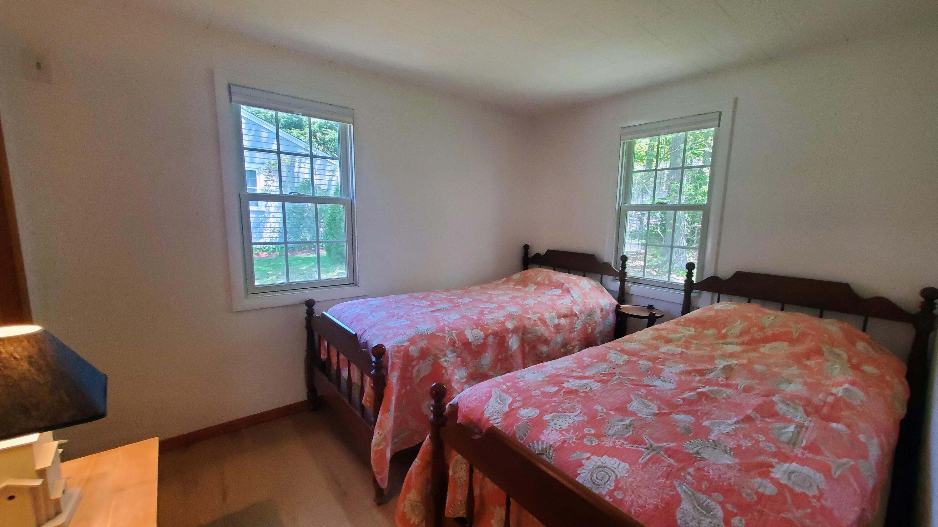 66 Uncle Edwards Road Mashpee, MA 02649 - Photo 13 of 18 a bedroom with two beds and a window