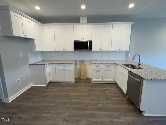 a view of a kitchen with electric appliances