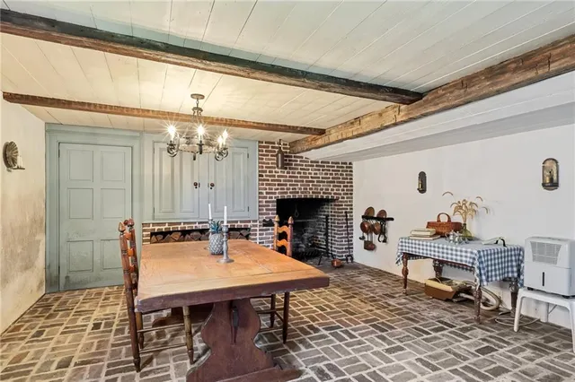 a living room with furniture a table and a fireplace