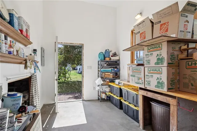 a room with furniture a rug toys and a window