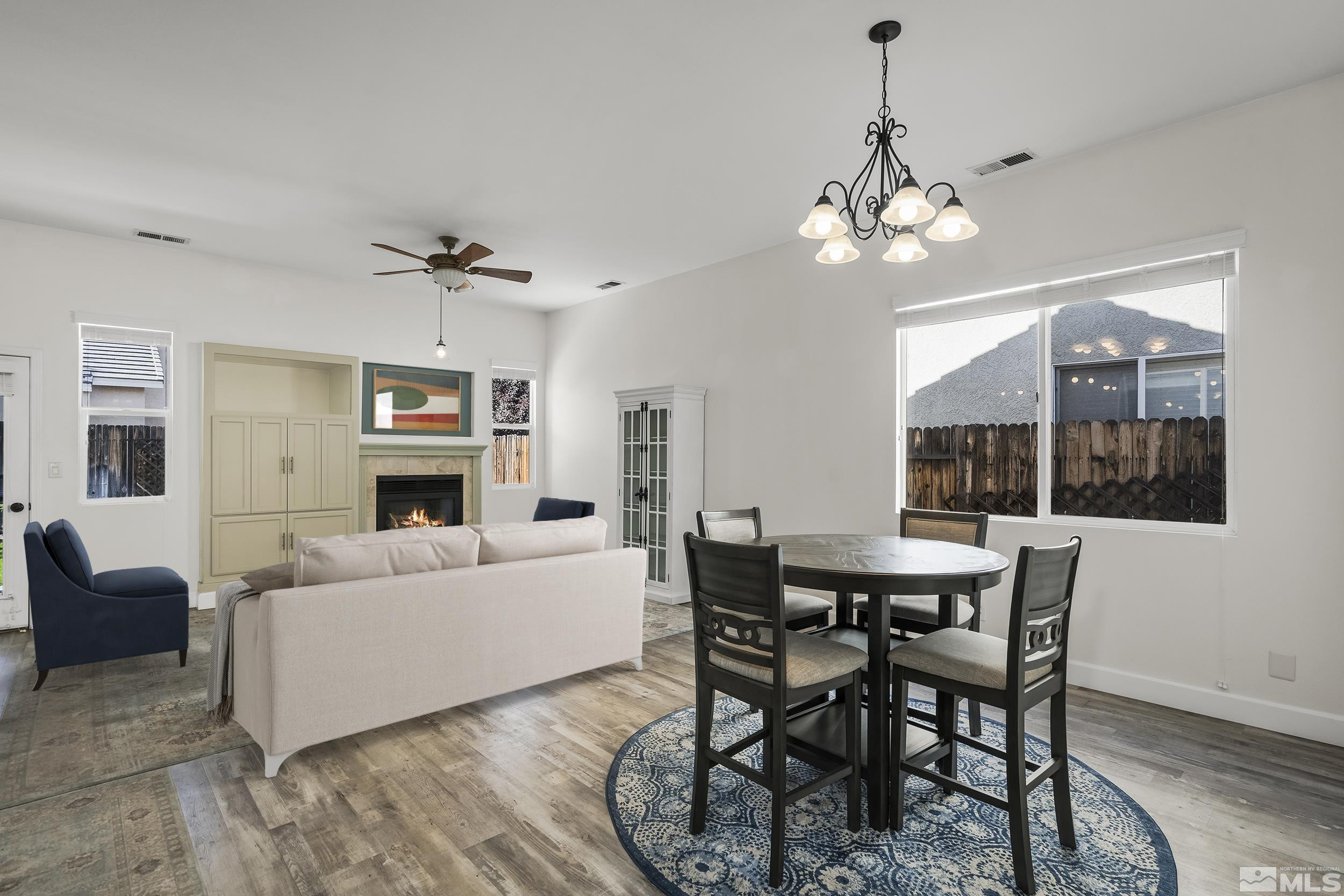 10245 Grizzly Hill Court Reno, NV 89521 - Photo 12 of 40 a living room with furniture a chandelier and a window