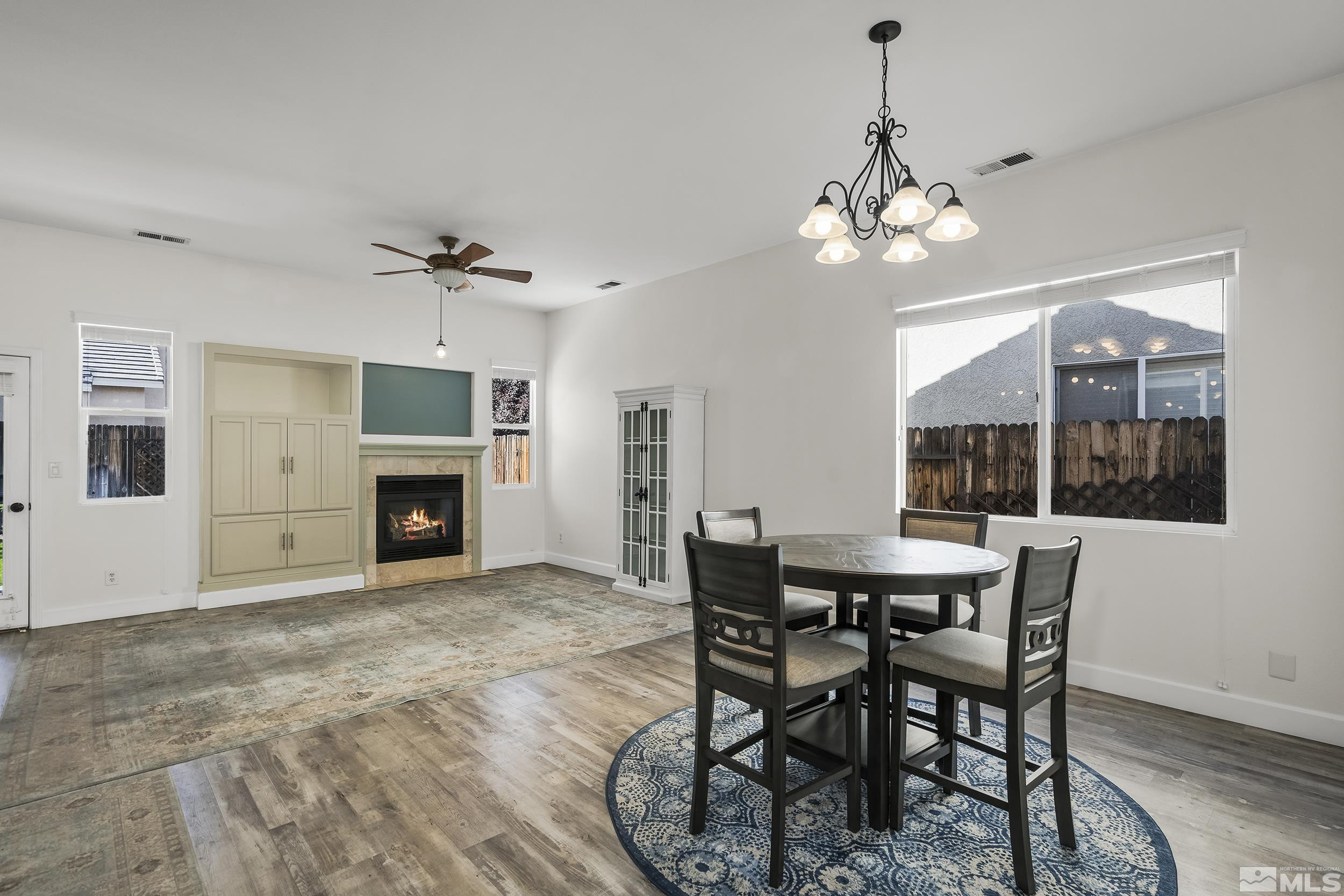10245 Grizzly Hill Court Reno, NV 89521 - Photo 13 of 40 a view of a dining room with furniture window and wooden floor