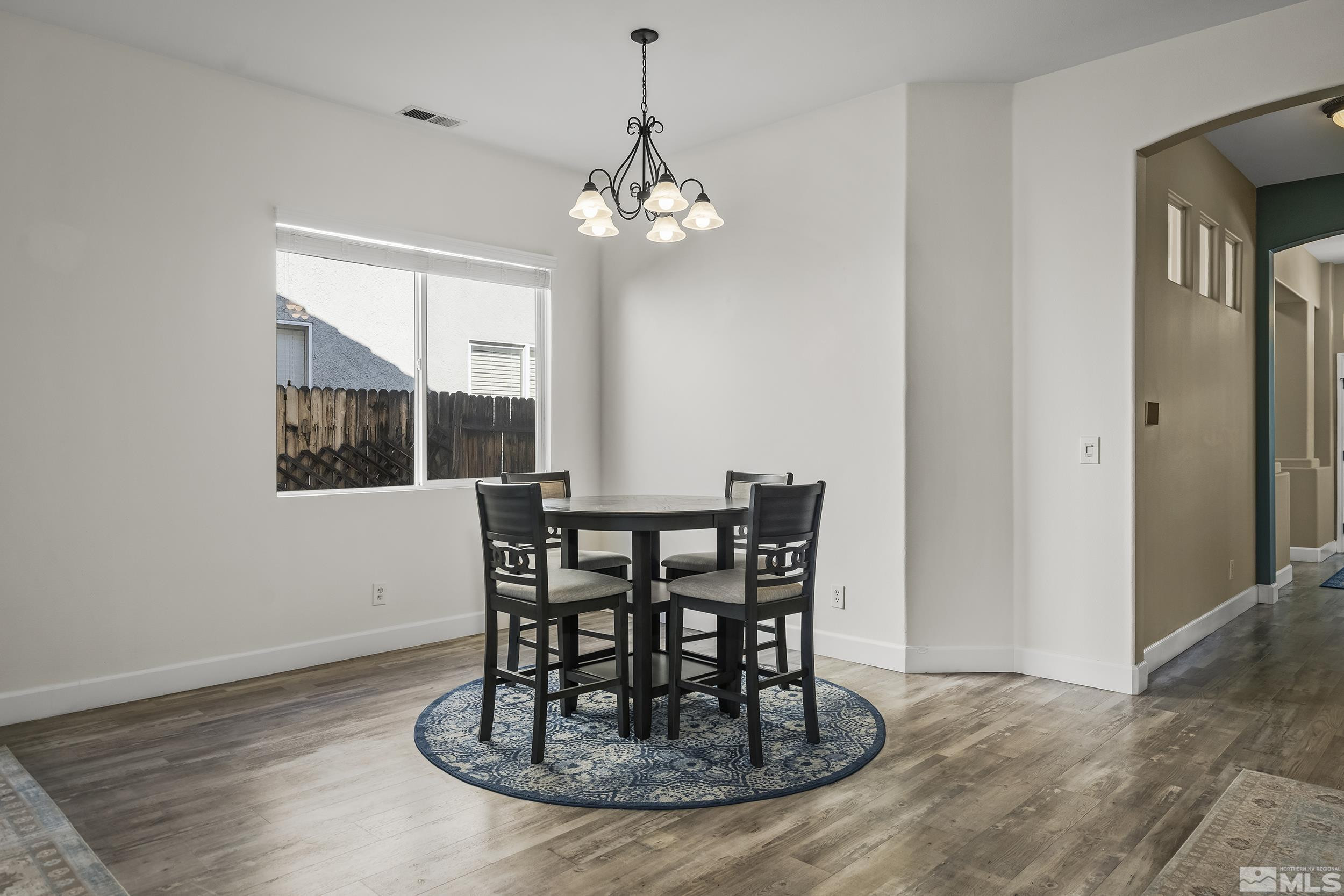 10245 Grizzly Hill Court Reno, NV 89521 - Photo 14 of 40 a view of a dining room with furniture window and outside view