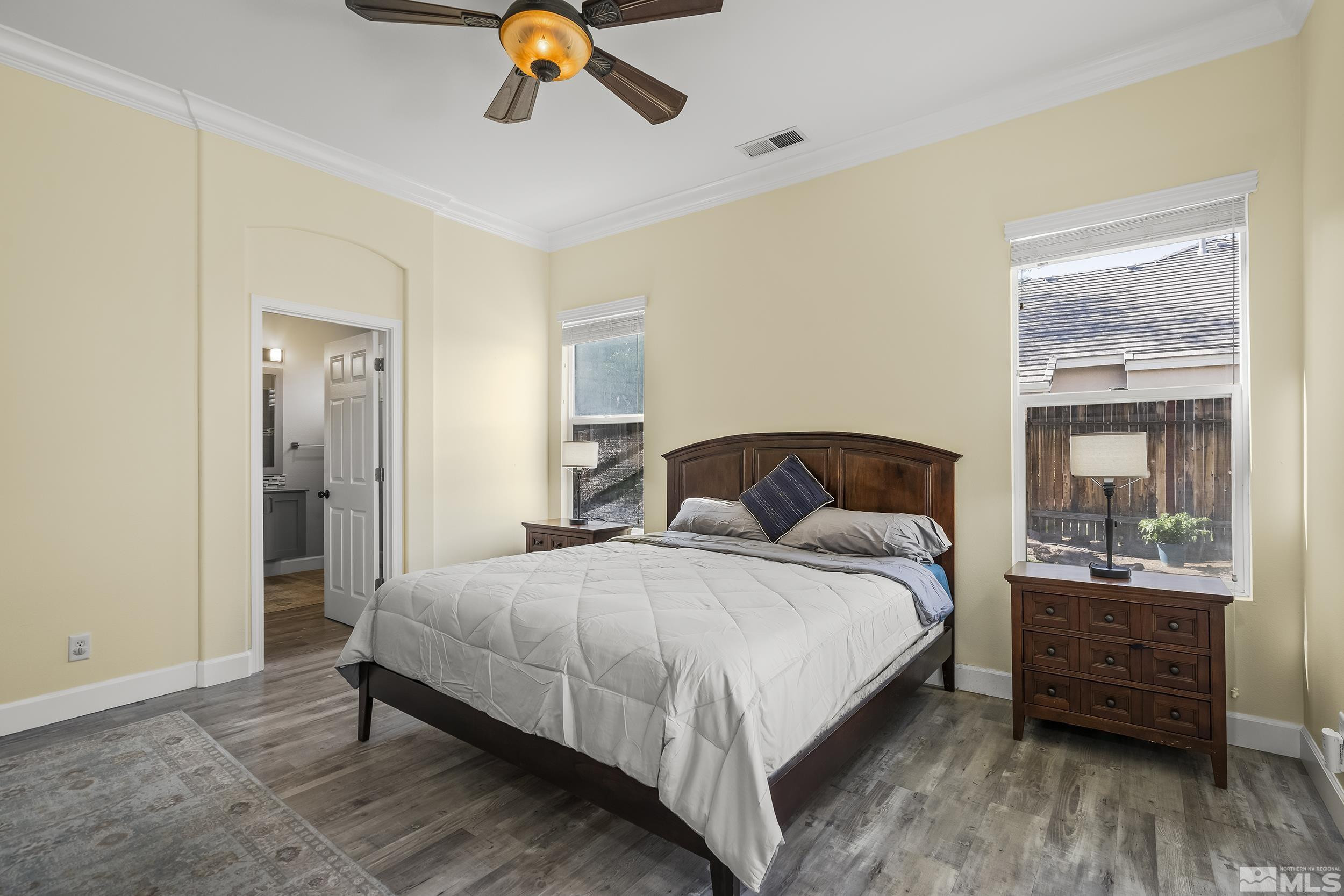 10245 Grizzly Hill Court Reno, NV 89521 - Photo 15 of 40 a bedroom with a bed and wooden floor