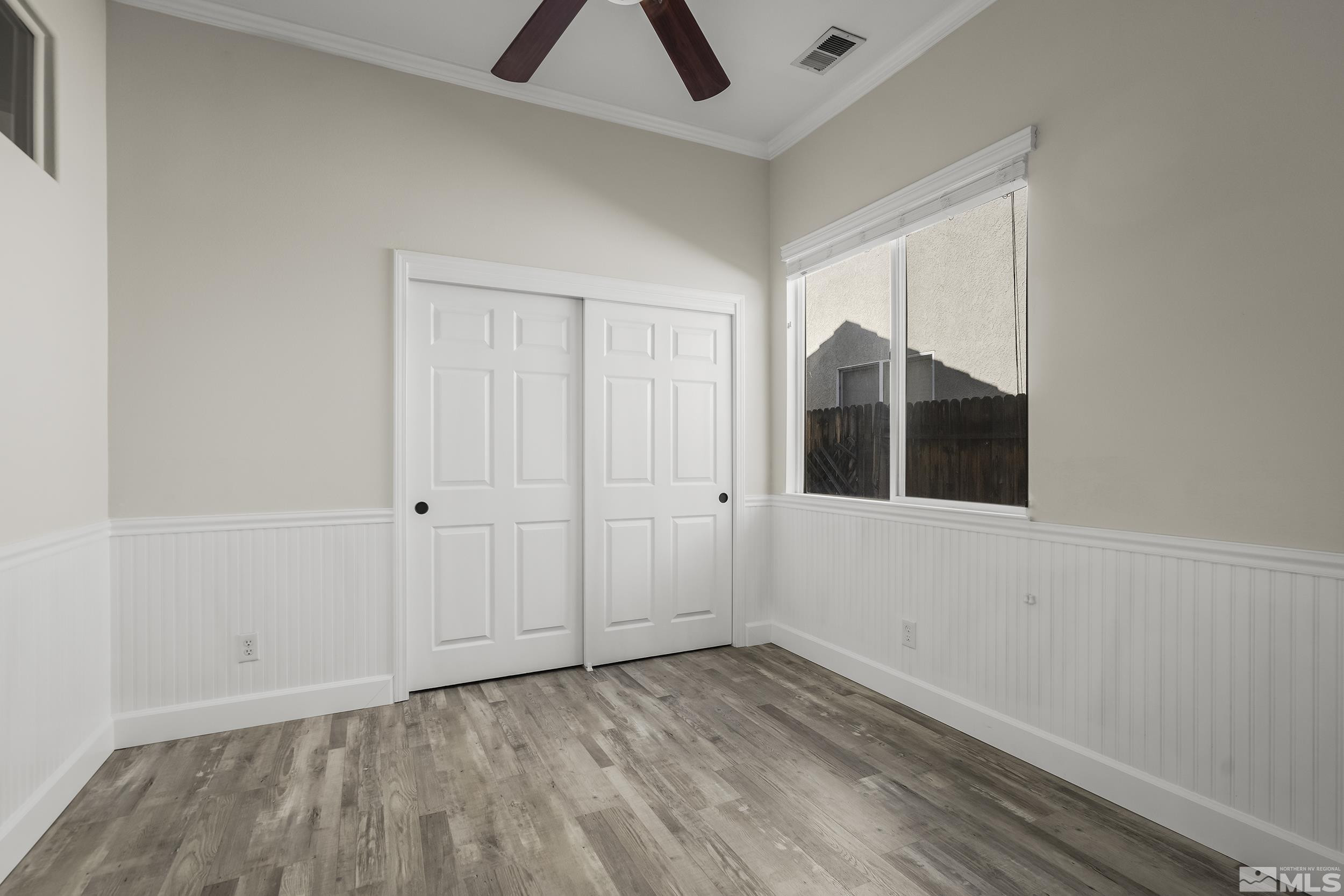 10245 Grizzly Hill Court Reno, NV 89521 - Photo 19 of 40 a view of an empty room with chandelier fan